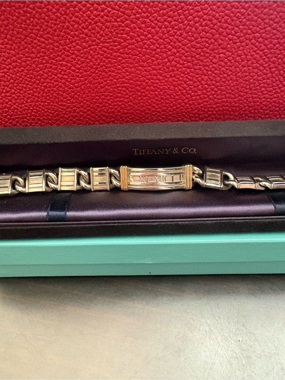 Tiffany & Co. Silver bracelet with solid yellow gold accent. Unisex bracelet